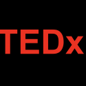 Red TEDx logo on black background